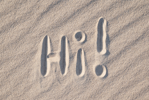 Sand alphabet written at beach