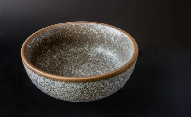 istock Ceramic dish for food on a dark background 2027718357