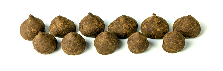 Banner chocolate truffles with cocoa, separated on a white background