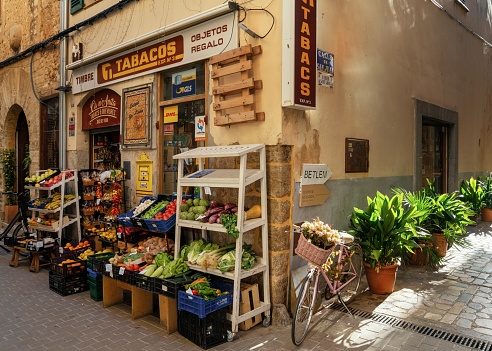 Soller, Spain - 31 January, 2024: quaint corner shop selling various goods and foods in the historic old town of Soller in northern Mallorca
