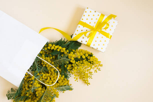 istock Yellow mimosa flowers frame with gift box. Womans day, easter , spring composition. Top view with copy space 2027759069