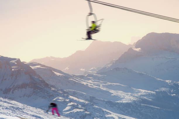 Young skier looking at glacier valley at Zermatt ski resort, Valais canton, Switzerland, in winter morning. Taken by Sony a7R II, 42 Mpix.