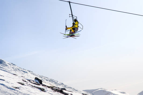Ski lift point of view.  Winter sport. Snow skier ski,  friends enjoying in ski lift,  sunny ski resorts Val Gardena  Snowcapped mountain  Dolomite super ski area. Ski resort. italy, Europe.