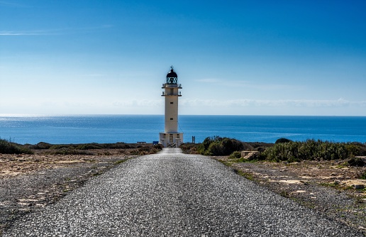 A long country road leads to the lighthouse at Cap de Barbaria on Formentera Island