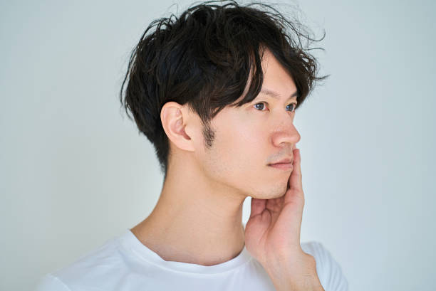 istock young man doing skin care 2027769378