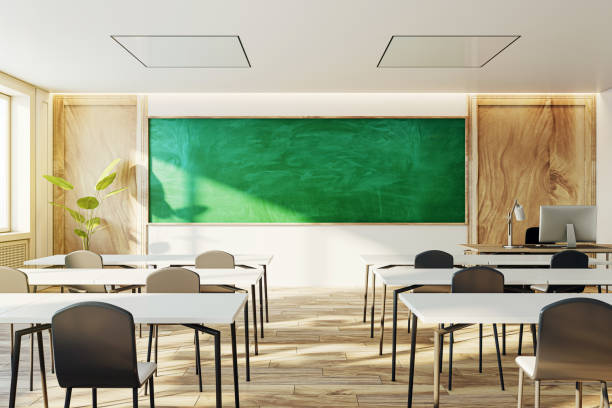 istock Contemporary classroom setting with green chalkboard and wooden elements, daylight interior. 3D Rendering 2027779639