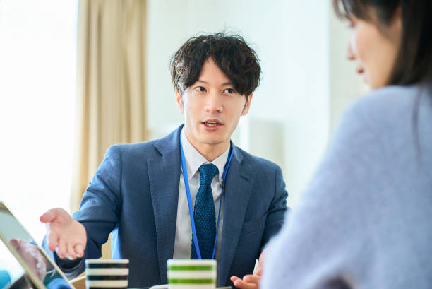 A man in a suit talking to a woman
