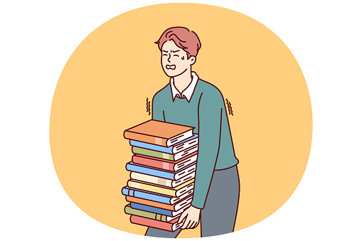 Exhausted man carries large stack of books suffering from overload while preparing for exams. Guy student who wants to go to college or university takes books and literature from library