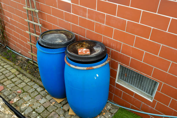 istock old blue plastic barrel for rainwater in the garden 2027841387