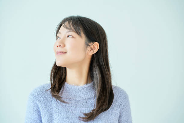 istock White background with smiling young woman 2027863677