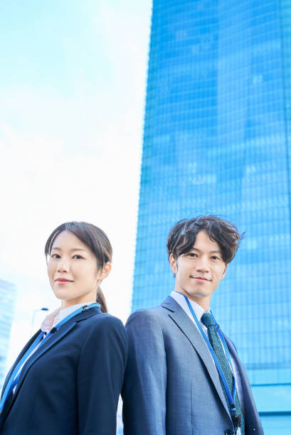 istock Man and woman in suits standing 2027871704