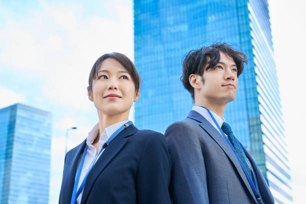 istock Man and woman in suits standing 2027872769