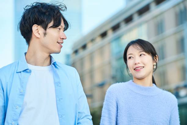 istock Young man and woman walking side by side 2027884009