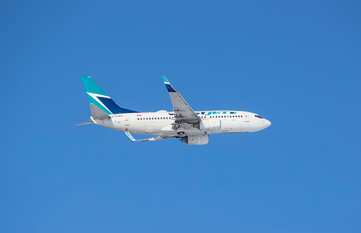 Calgary, Alberta, Canada. February 18, 2024\nA WestJet Airlines Boeing 737-7, with identification C-FUWS, taking off from Calgary International Airport
