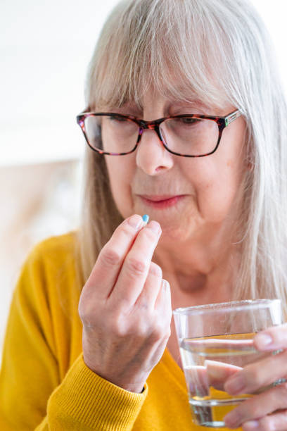 istock Senior woman taking a medical pill 2027889290