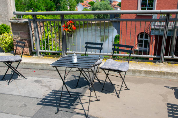istock Tables with chairs in cafe outside near the river. 2027903252
