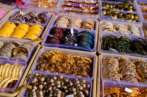 Indian colorful bangles displayed in local shop in a market of Pune, India, These bangles are made of Glass used as beauty accessories by Indian women.