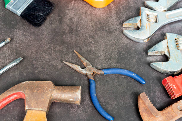 istock Old tools on concrete floor. Renovation, maintenance and repairing concept. 2027924188