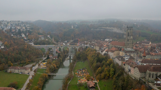 Aerial view drone footage of Fribourg famous old town in day time Switzerland,Aerial view of the Gothic style cathedral and the medieval old town in Fribourg in Swizterland