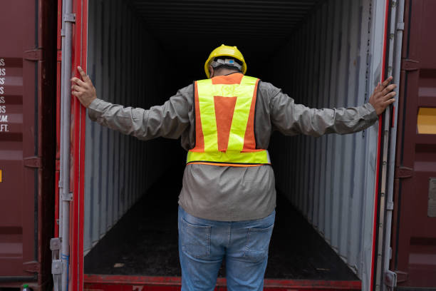 Middle east logistic worker engineer or foreman open the door container and working at container site