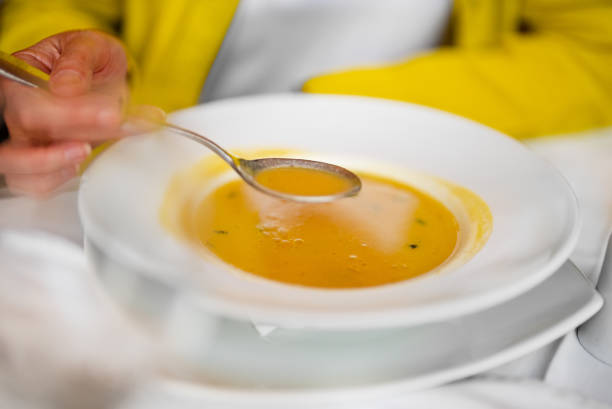 Homemade cocido Soup with pasta on a plate Spain