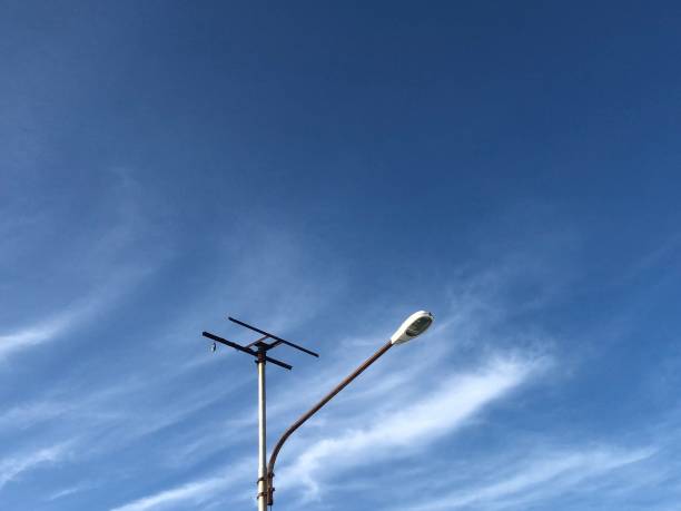 istock Street lamp in bright daytime with blue sky and white clouds 2027993990