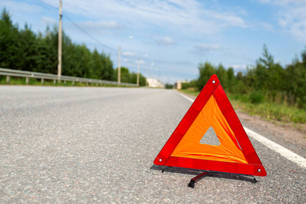 istock Red triangle emergency stop sign on asphalt road. Nobody 2028032166