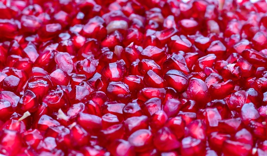 Closeup of Pomegranate Seeds Stack Background in Horizontal Orientation.