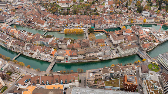 Drone Aerial view of city townscape against sky, lake canal and mountain contour landscape Thun,Bern,Switzerland