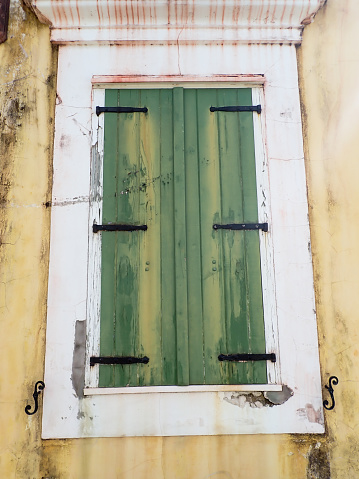 This is the style of hurricane doors used for decades on St. John, USVI. The weather wood showed the effects of years of wind and wind blown rain, sand and salt.