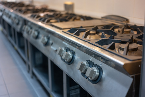Gas Hob Stove and Grill in Professional Kitchen Restaurant