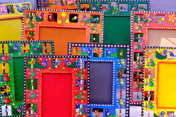 Colorful Hand painted wooden photo frame, painted with birds and figures.