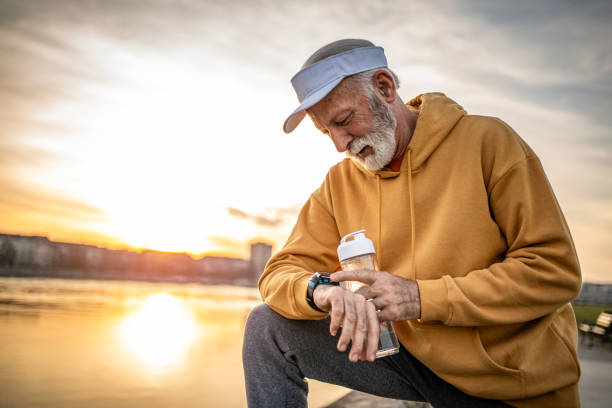 istock After training, in step with modern technology, the senior checks information about training, kilometers traveled and calories burned 2028104162