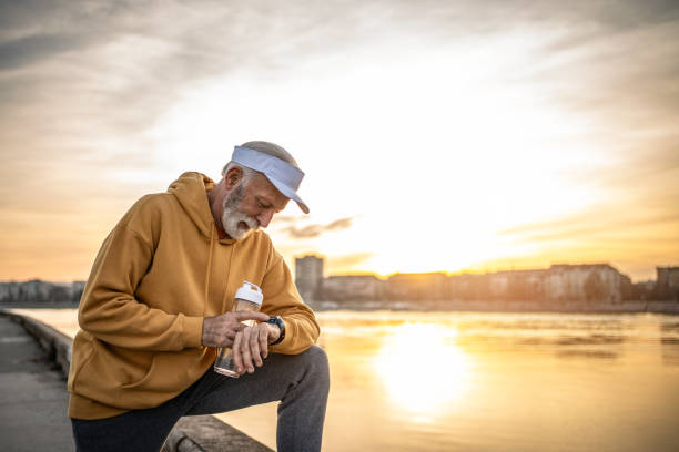 istock Active senior man resting and drinking water after exercise. A healthy retirement lifestyle. 2028104642