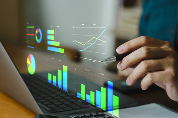 istock Business people using laptop with digital visual reality of graphics, graph investments for analysis market and demand. 2028108978