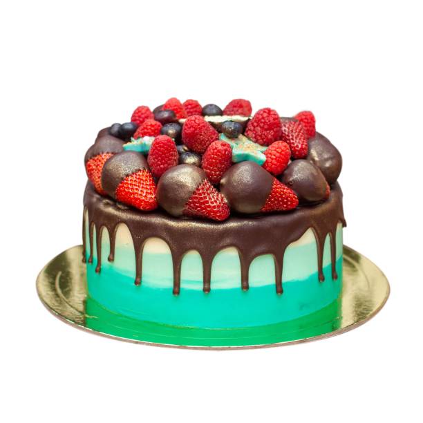 istock Green Birthday Cake with chocolate ganache and fresh berries isolated on white background, close up, png with copy space aside 2028111625