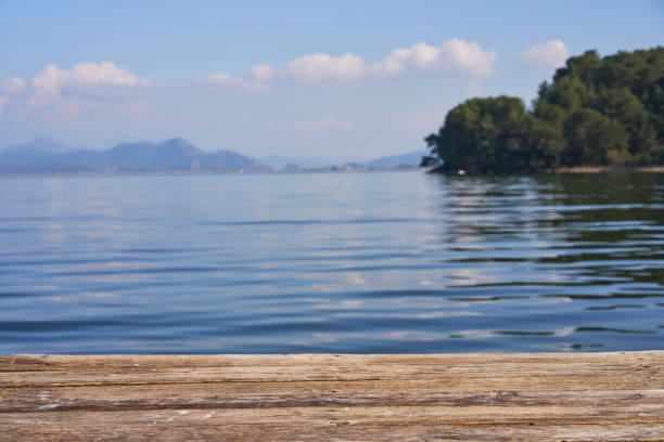 istock Empty Wooden Planks with Blur Beach on Background 2028117989