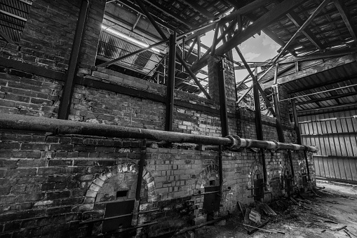 Closed for over 50 years this abandoned brickworks located near the Grampians mountain range in Victoria, Australia retain their past glory in furnaces, pipes and items left by those who last worked in and around the massive kilns that are slowly crumbling.