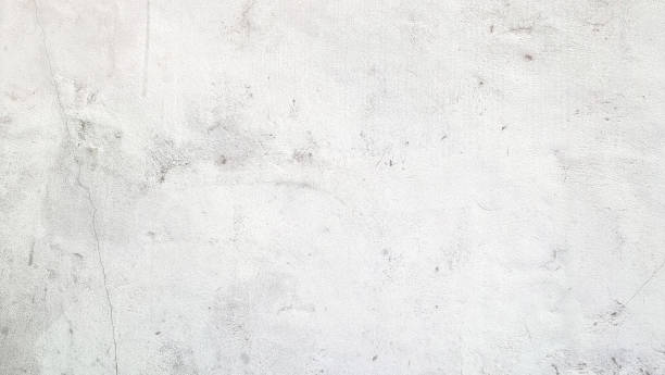 istock exposed white concrete wall texture used for background. old grungy texture, grey concrete wall.  aged concrete wall with scuffs of gray color. background included free copy space. 2028125928