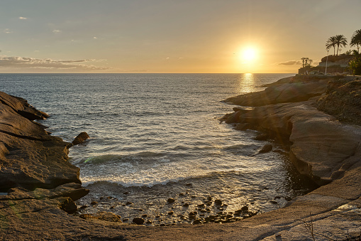 Atlantic oceanscape during sunset with waves and rocks