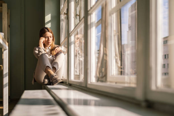 istock Young Businesswoman Reflecting by the Window 2028150318