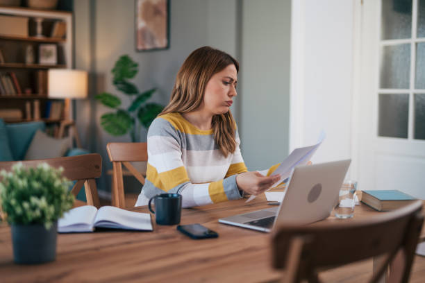 istock mature woman works from home and is worried about work. 2028150332