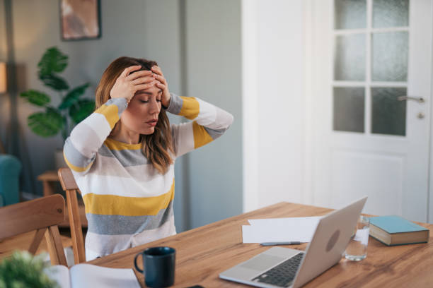 istock mature woman works on her laptop. 2028152035