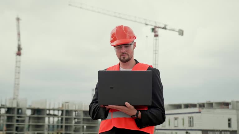 Young professional male working at construction site