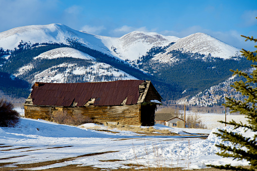 Como, Colorado, USA - February 12, 2024: An old wooden building in historic Como, a former coal mining and railroad town in Park County.