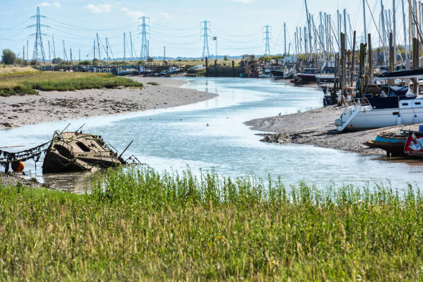 Various boats and Yachts in Oare Creek near Faverhsam in Kent stock photo