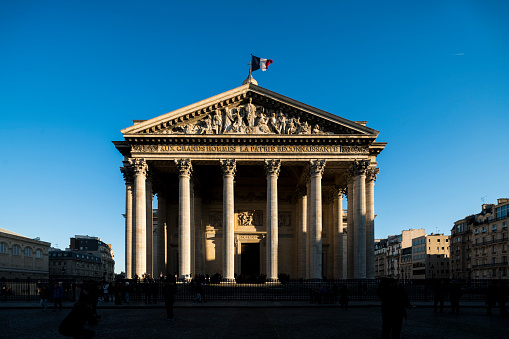 Paris, France-10 04 2022: People in front of the Pantheon. The Pantheon is a building in the Latin Quarter in Paris, France, was originally built as a church, now functions as a secular mausoleum containing the remains of distinguished French citizens.