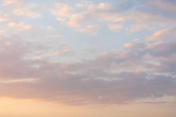 Beautiful colorful cloudy sunset sky background Backgrounds of colourful and beautiful sunset / sunrise with clouds with sunlight on dramatic sky texture sky stock pictures, royalty-free photos & images