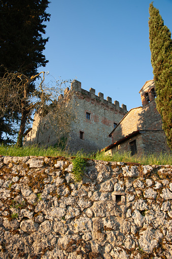 Battlement and stone walls from low point of view  from street below