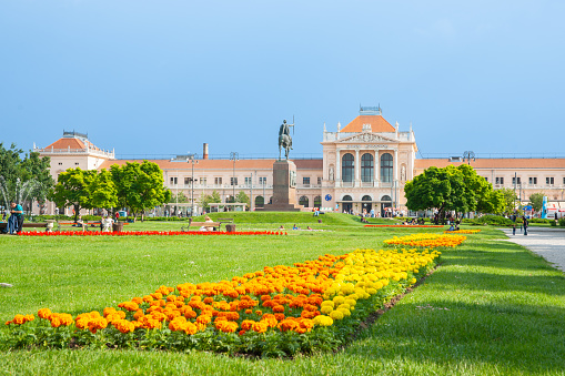 Zagreb Croatia - May 24 2011; European railway station with colourful gardens.of marigold flowers leading to station.